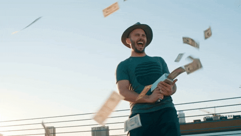 Man shooting money from device