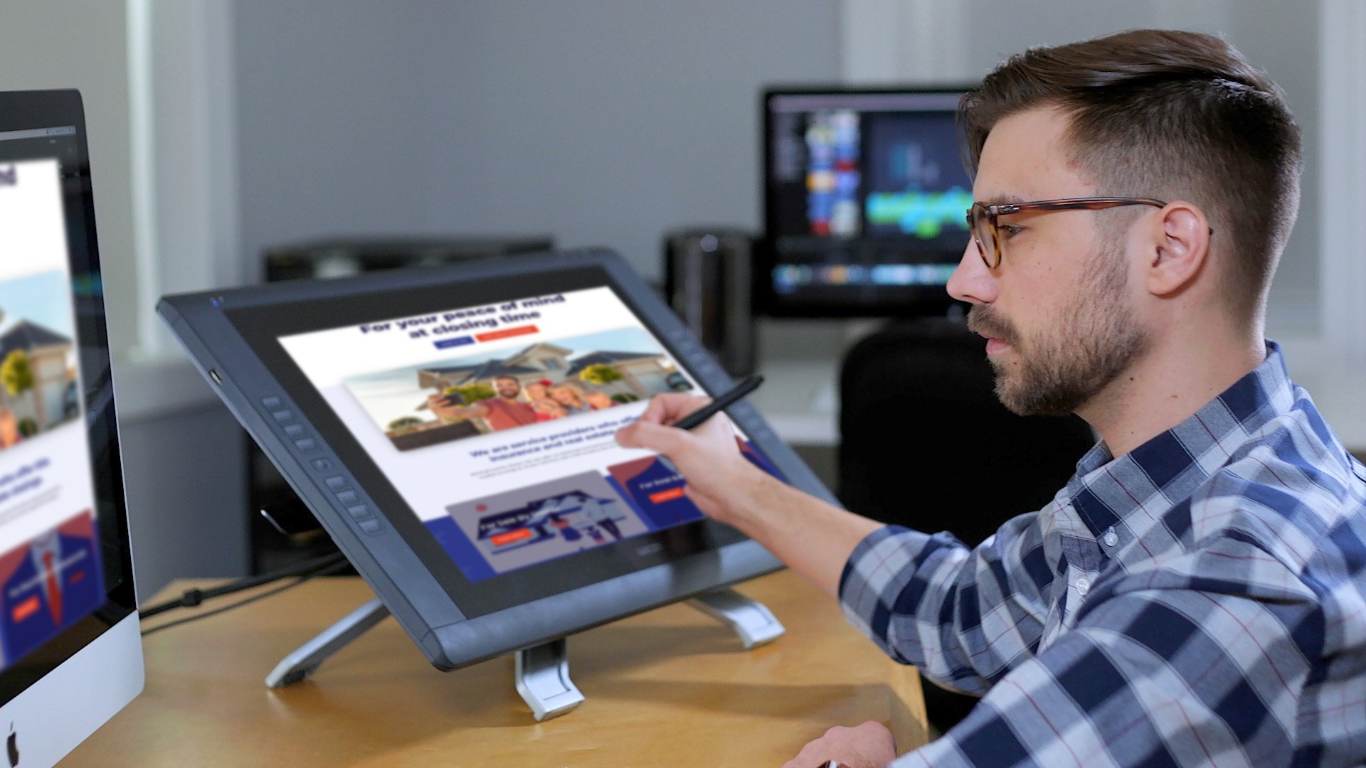 a photograph of a graphic designer designing a website.